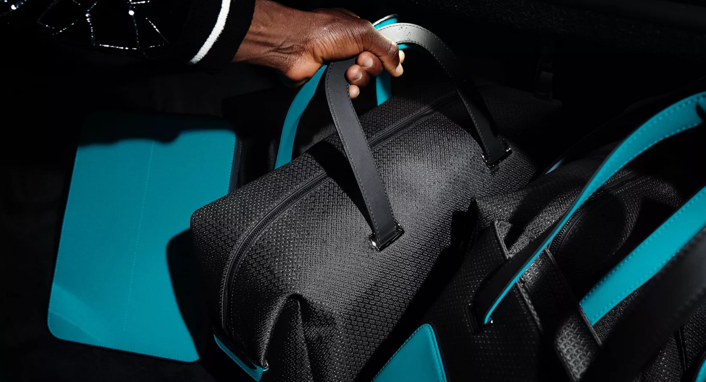 BLACK BADGE ESCAPISM LUGGAGE COLLECTION