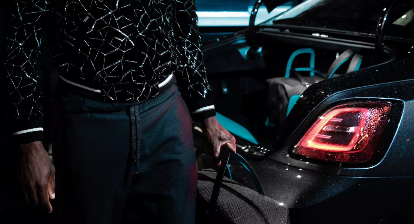 BLACK BADGE ESCAPISM LUGGAGE COLLECTION